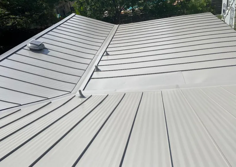 Solar attic fan installed on a metal roof for Roof Ventilation in Mamakating